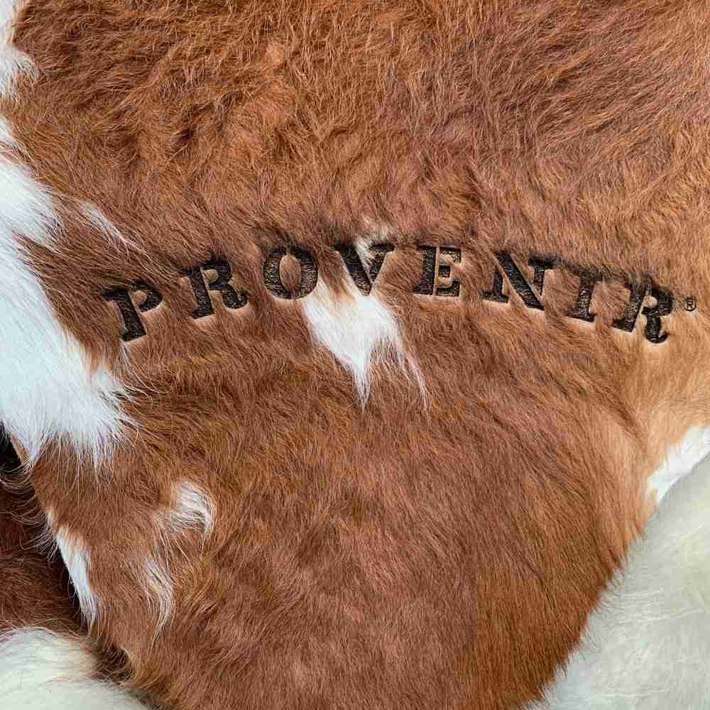 cow hide rug wth Provenir logo