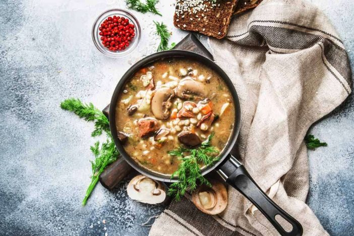 autumn or winter meat vegetable mushroom hot soup with beef and