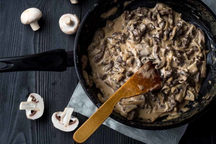 metal skillet beef stroganoff in a thick with mushrooms