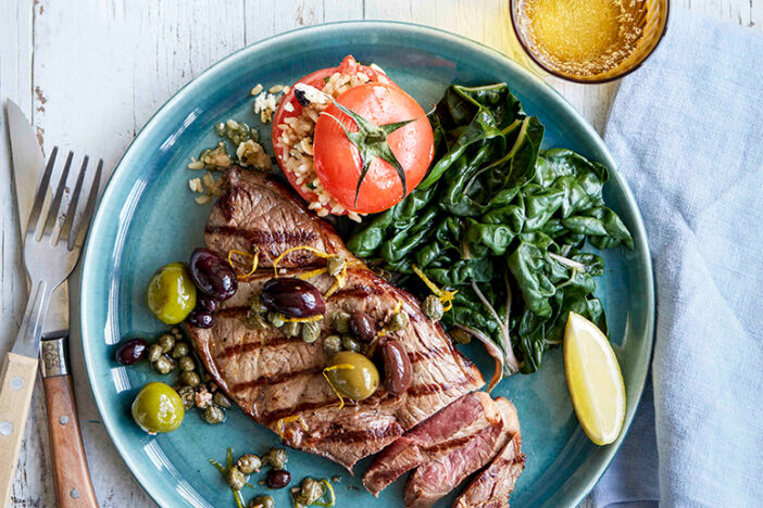 char grilled rump steak with mixed olive sauce and stuff tomatoes sq
