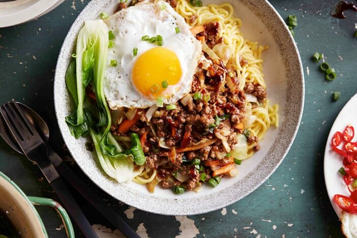 asian beef mince noodle bowl with fried egg